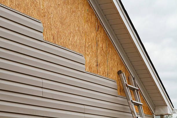 Professional Vinyl Siding technician working in Somerville, MA